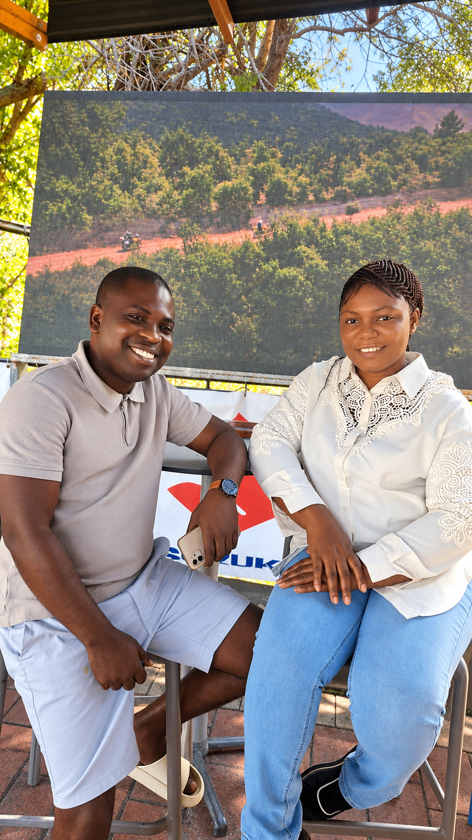 Mr. and Mrs. Akinpelu smiling together outdoors